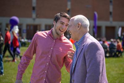 President Kaufman Laughing With A Student